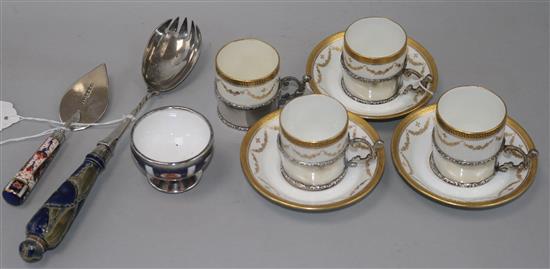 A part set of Paragon silver-mounted coffee cans and saucers, a Victorian silver-mounted trowel/slice and two other items,